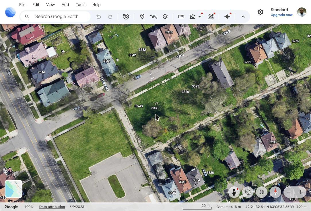 Wider aerial context view showing the Northwestern lots backing onto the alley, with the Lothrop-side block beyond